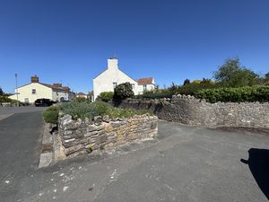 View from Pavement by Driveway towards House- click for photo gallery